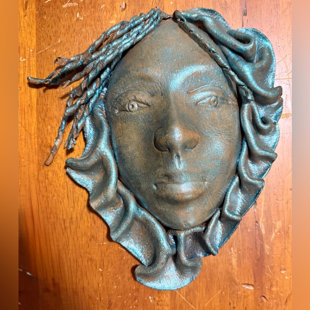 Handcrafted Leather Face mask with headwrap,showing a unique artistic style.